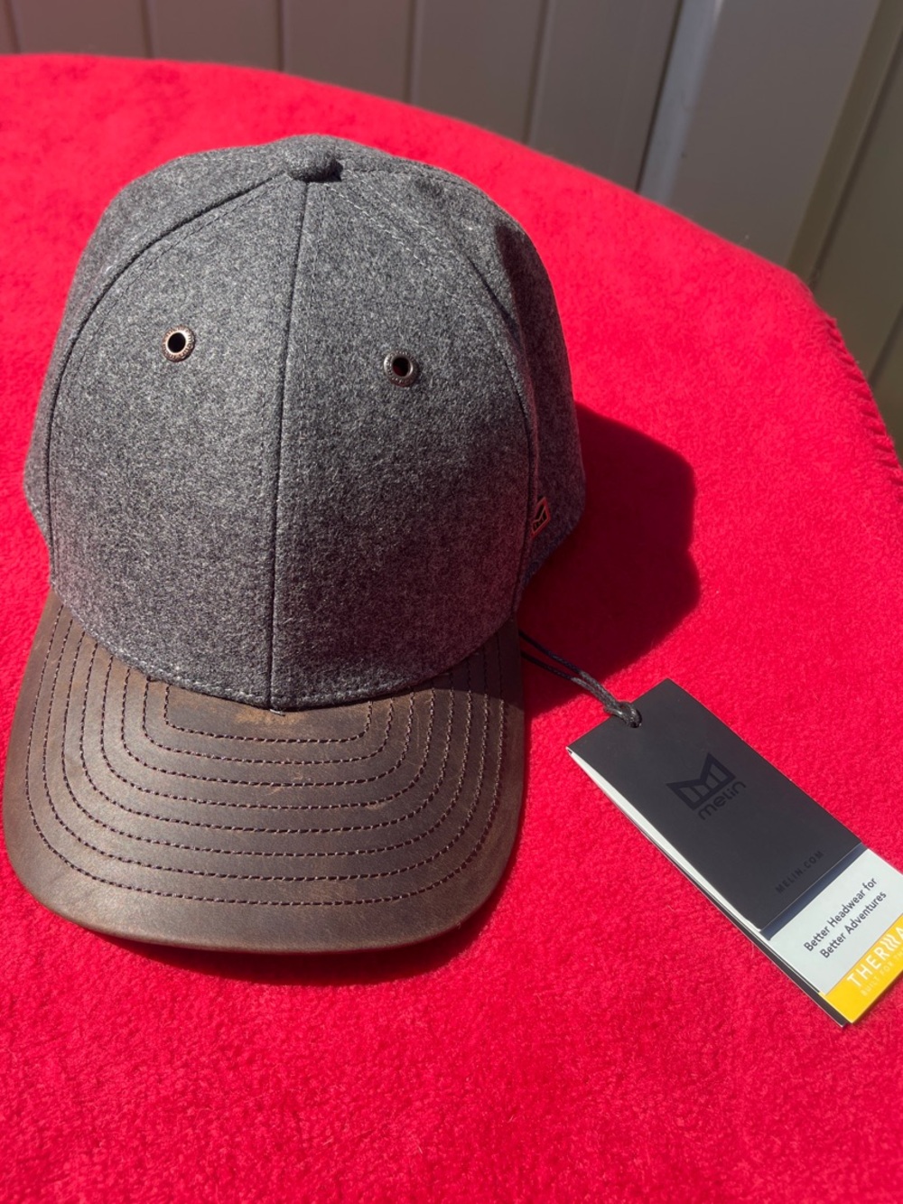 Melin Luxury Gray Cap with Brown Brim. Unused New Condition.